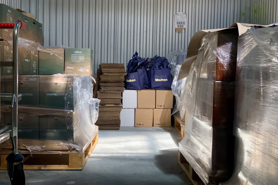 Stacked shipping boxes in a clean warehouse.